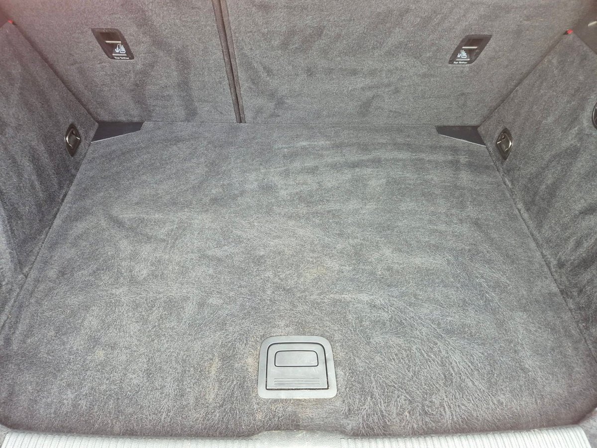 Car boot interior steam cleaned, with carpets and trim finished
